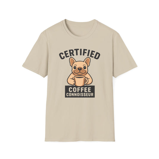 Sand color t-shirt with a dog holding a coffee cup graphic and text 'Certified Coffee Connoisseur' on a white background.