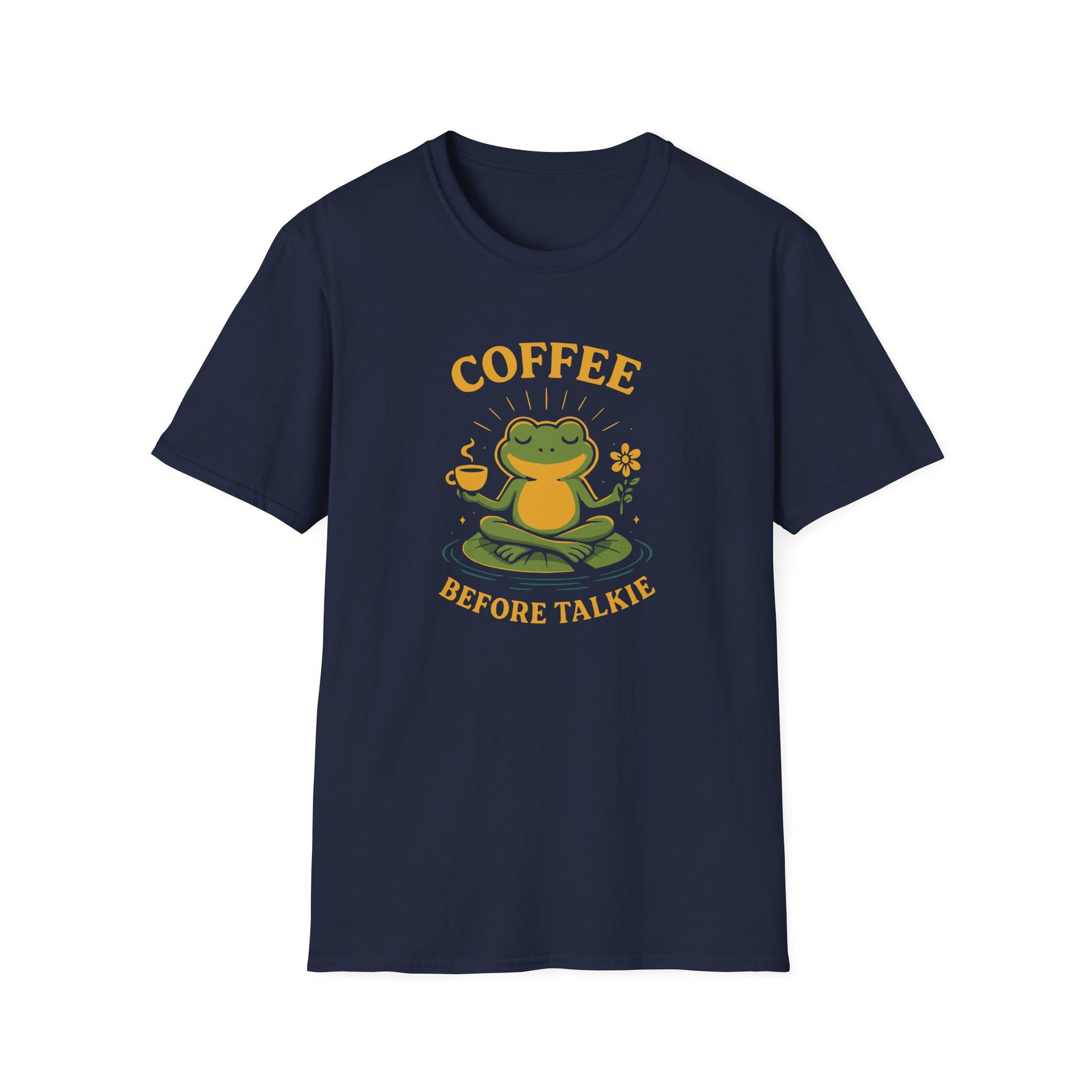 Navy color t-shirt with ’Coffee Before Talkie’ text on top and bottom of a smiley and seated frog holding a flower on her left hand and a freshly made coffee on a mug on her right hand design on a navy background