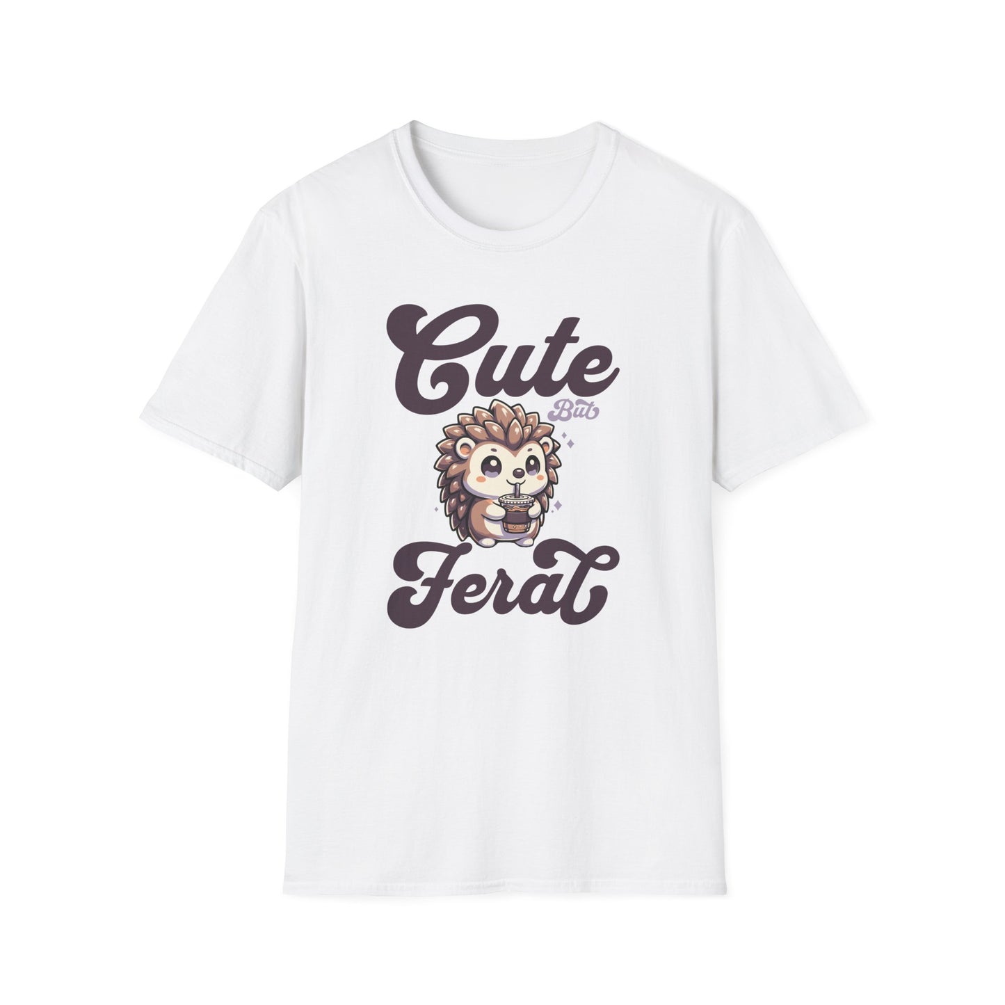 White color t-shirt with ’Cute But Feral’ text on top and bottom of a super cute hedgehog drinking an iced coffee from a to go coffee cup design on a white background