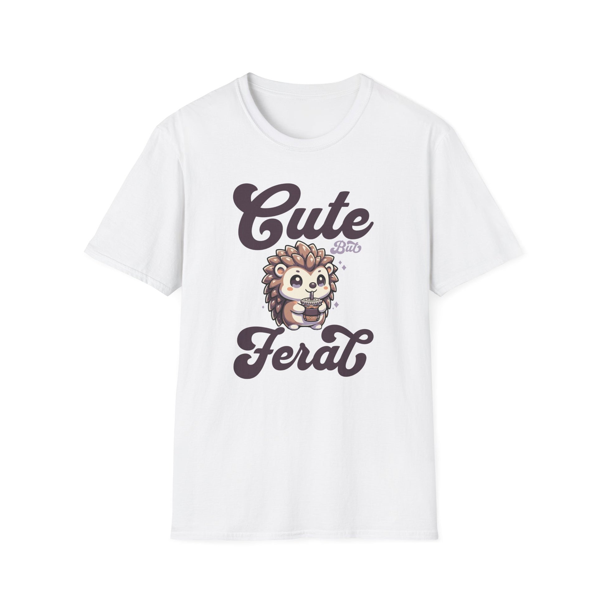 White color t-shirt with ’Cute But Feral’ text on top and bottom of a super cute hedgehog drinking an iced coffee from a to go coffee cup design on a white background