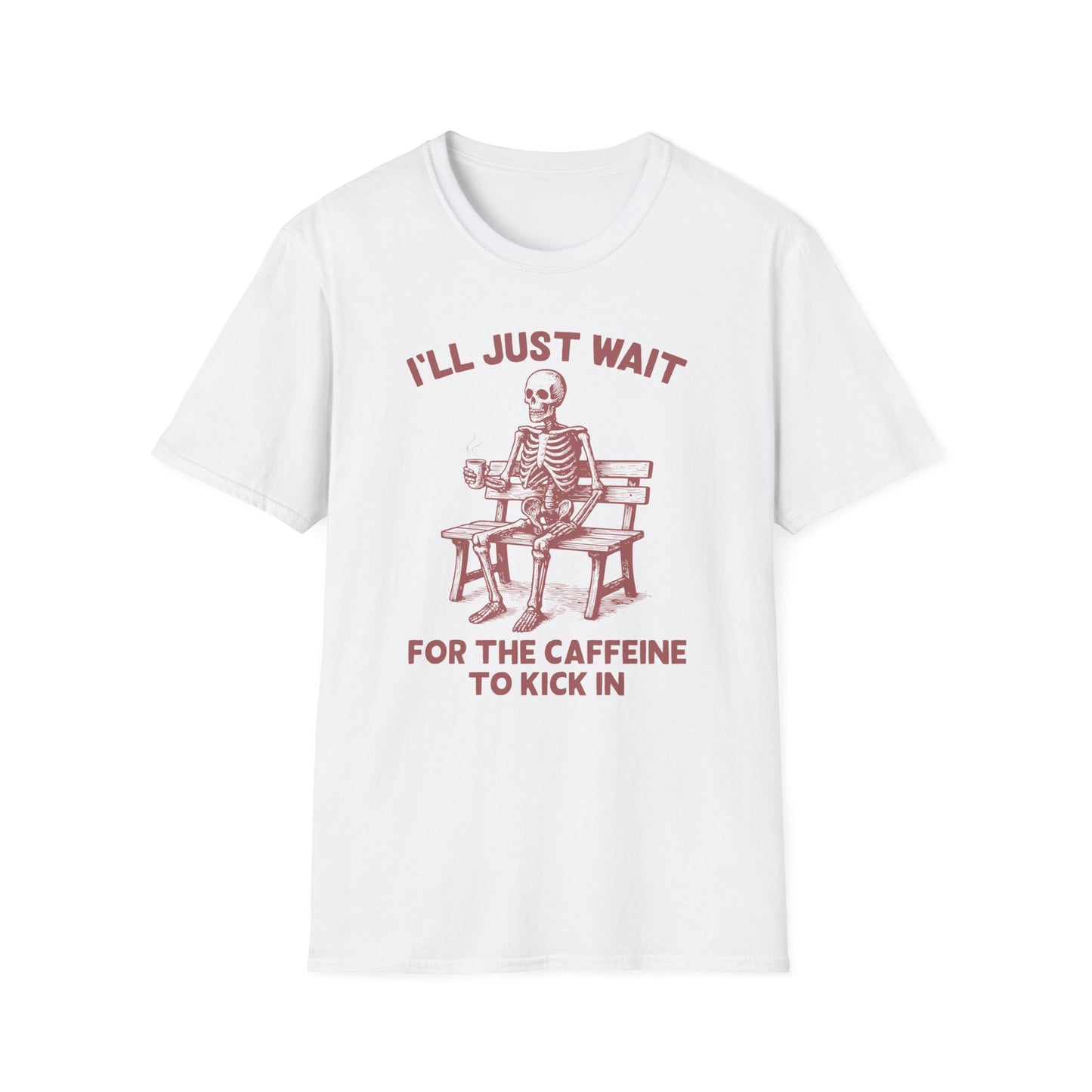 White color t-shirt with ’I’ll Just Wait For The Caffeine To Kick In’ text on top and bottom of a skeleton seating on a wooden bench and holding a freshly made coffee on a mug design on a white background